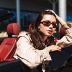beautiful-girl-in-sunglasses-leaning-on-cabriolet-NT5RKVQ.jpg